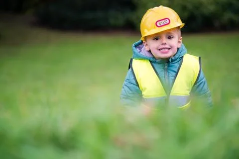 Boy pretending to be a builder foreman Stock Photos