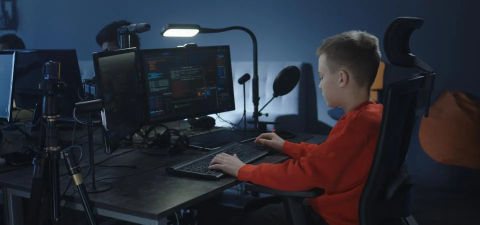 Boy programming in an office Foto stock