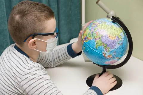 Boy in a protective mask Stock Photos
