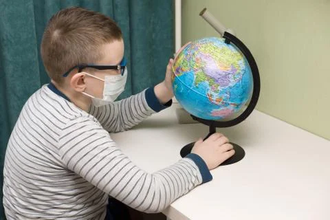 Boy in a protective mask Stock Photos