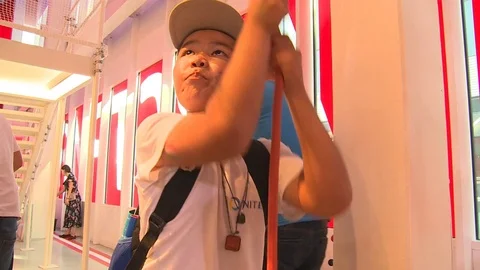 Boy pull rope string in modern playground in Austria EXPO 2017 pavilion Stock Footage 78691983