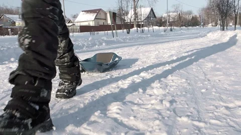 Boy pulling a sled Stock Footage 237479026
