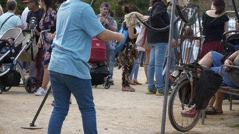 Boy pulling string puppet art figure at "La Merçe" holiday event in Stock Footage 120710336