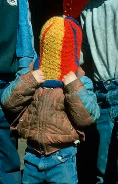Boy pulling wool cap over his head, Paradise, Montana Stock Photos