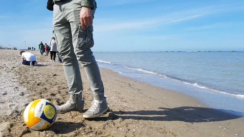 Boy pulls the ball on the shore Stock-Footage 88222754