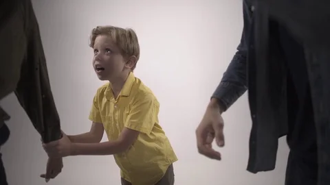 The boy pulls the hand of his parents, who are cursing. Slow motion Stock Footage 119522025