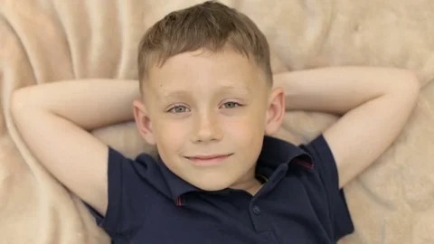 The boy put his hands under his head Stock Footage 76135134