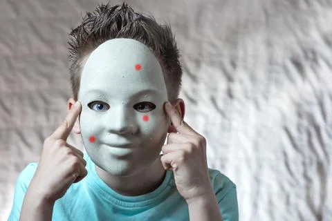 The boy put on a mask with pimples Stock Photos