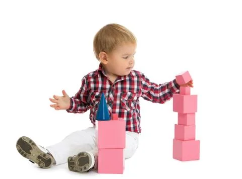 Boy puts pyramid Stock Photos