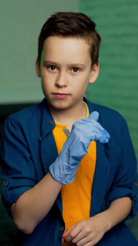 Boy puts on rubber gloves. Stop coronavirus. Stock Footage 270313356