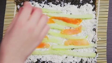 Boy puts salmon Stock Footage 232810341