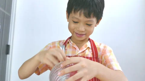 Boy putting ingredients on pizza Stock Footage 55810199