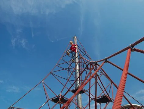 Boy on pyramid net climber Stock Photos