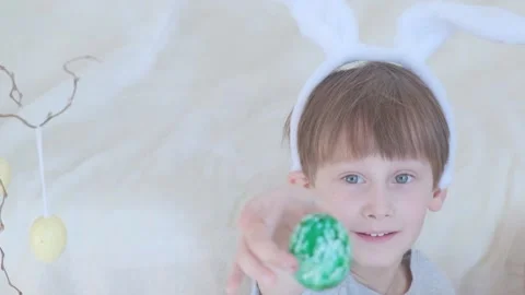 Boy with rabbit ears on his head. Portrait Easter child. Stock Footage 149870975