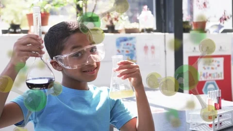 Boy raising tilting flasks, curiosity driving checking lab liquids, molecule Stock Footage 334373045