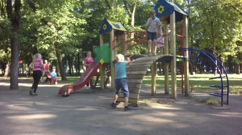 The boy ran over a squirrel. Children play on the playground Video stock 64807907