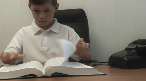 Boy reading the bible. the camera moves Stock Footage 39306684
