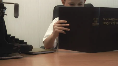 Boy reading the bible. the camera moves Stock Footage 39306953