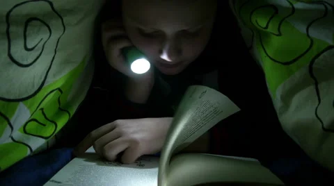 Boy Reading Book In Bedroom With Flashlight 스톡 동영상 45819066