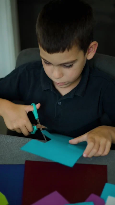 Boy Reading Book at Desk Vertical Video Slow Motion Video stock 343451546