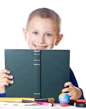 Boy reading a book Stock Photos
