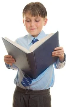 Boy reading a book Stock Photos