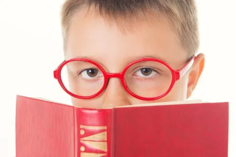 Boy reading a book thirsty for knowledge - isolated over a white background Stock Photos