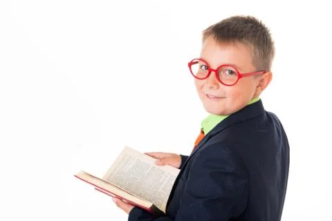 Boy reading a book thirsty for knowledge - isolated over a white background Foto stock