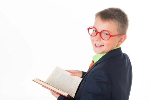 Boy reading a book thirsty for knowledge - isolated over a white background Stock Photos