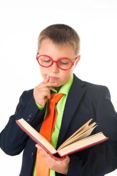 Boy reading a book thirsty for knowledge - isolated over a white background Stock Photos