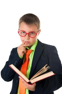 Boy reading a book thirsty for knowledge - isolated over a white background Stock Photos
