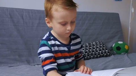 Boy reading e-book Stock Footage 99111546