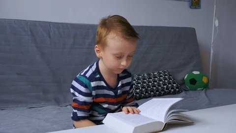 Boy reading e-book Stock Footage 99112916