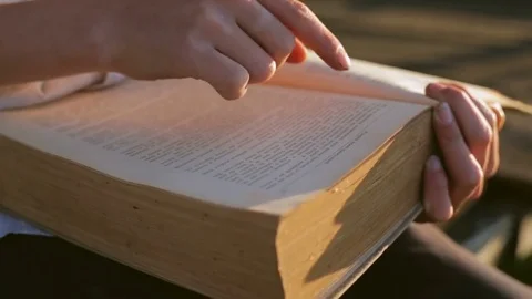 Boy is reading an old book 스톡 동영상 78023029