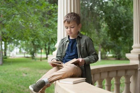 Boy reading in the Park Stock Photos