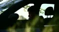 A boy reading in a parked car HD Footage