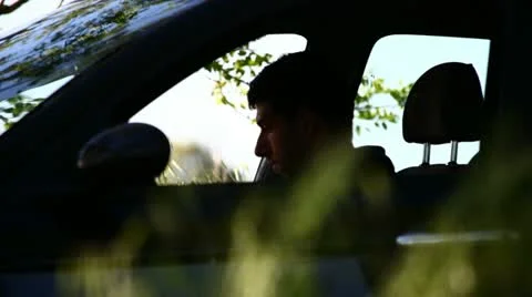 A boy reading in a parked car Stock Footage 11122128