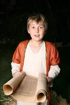 Boy reading a scroll Stock Photos