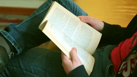 A boy reads a book Stock Footage 88459639