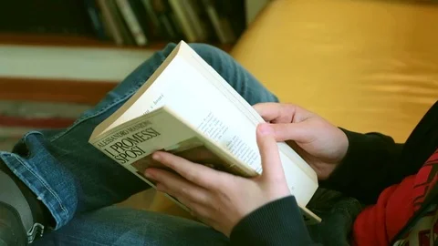 A boy reads a book Stock Footage 88459650