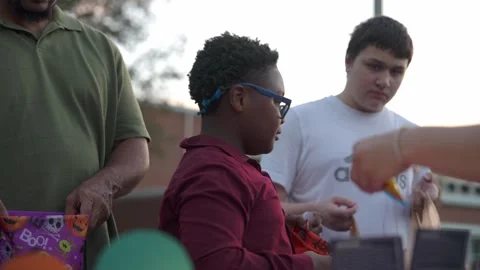 Boy Receiving Candy at Halloween Table Stock Footage 318112032