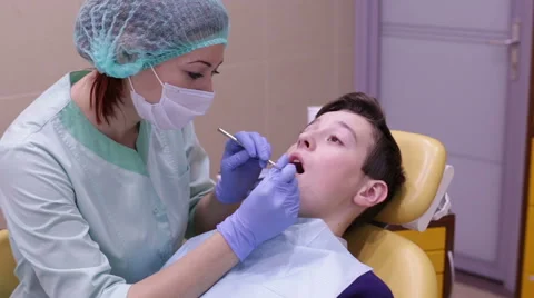 The boy on reception at the dentist Stock Footage 57925702