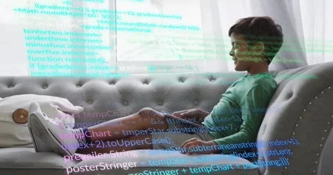 Boy reclining on grey sofa tapping tablet, launching cyan purple code overlay Stock Footage 329812711