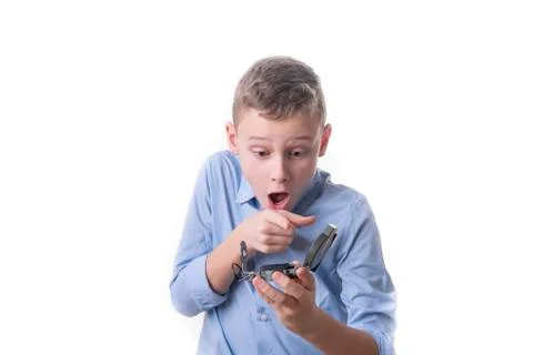 Boy recognizes on a compass in his hand the right direction for the future on Stock Photos