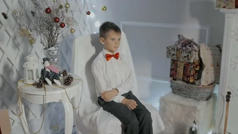 The boy in the red bow tie and shirt posing Stock Footage 81933689