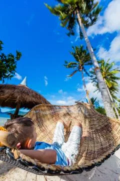 Boy relaxing on a beach 写真素材