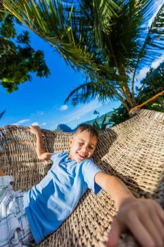 Boy relaxing on a beach Foto stock