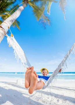 Boy relaxing on a beach. Photos