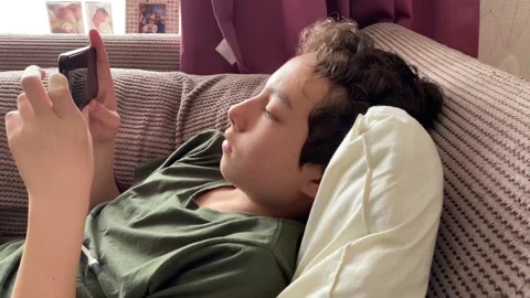 Boy Relaxing watching video Stock Footage 175278635