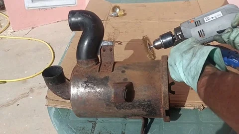 Boy remove rust off a car air filter with a drill outdoors, audio Stock Footage 171084817